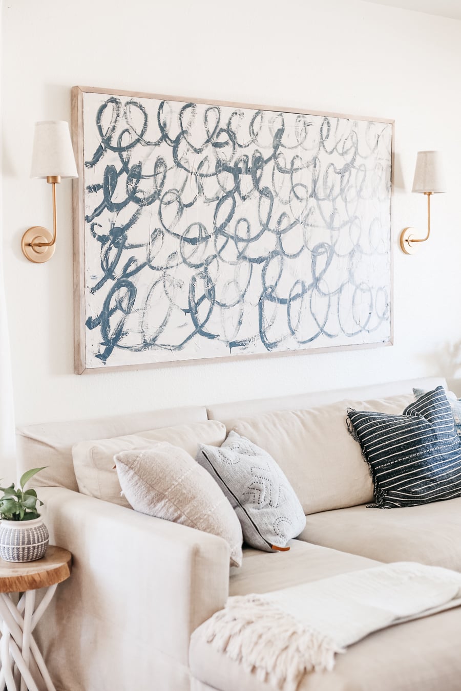This DIY Canvas Painting Tutorial shares how to actually make a DIY Canvas. Budget friendly large scale art that you can create yourself.